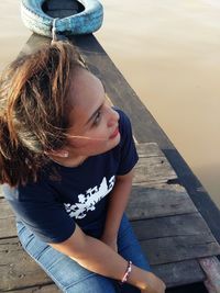 High angle view of woman sitting in water