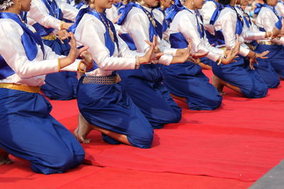 Rear view of people dancing in traditional clothing