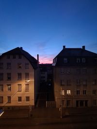 Buildings against sky at sunset