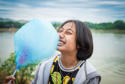 Portrait of smiling woman holding water