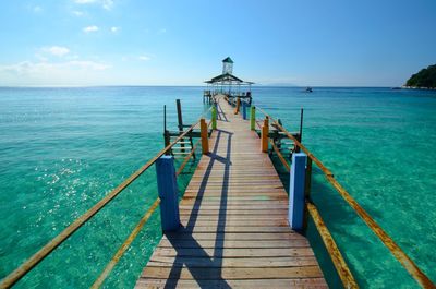 Pier over sea against sky