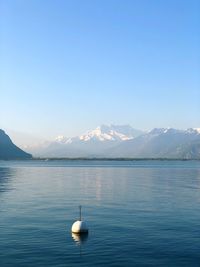 Scenic view of lake against blue sky