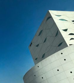 Low angle view of building against blue sky