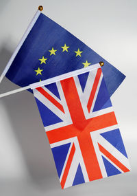 Low angle view of flag against blue sky