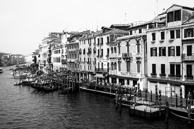 Buildings by grand canal against sky in city