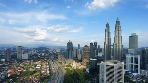 View of city against cloudy sky