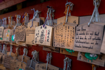 Panoramic view of text hanging in row at temple