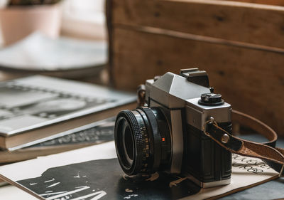 Close-up of camera on table