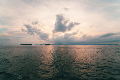 Scenic view of sea against sky at sunset