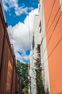 Low angle view of building against cloudy sky