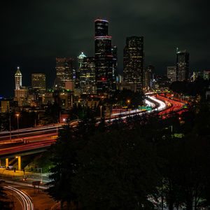 High angle view of illuminated city buildings at night