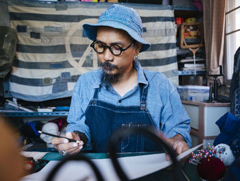 Man working over paper on table