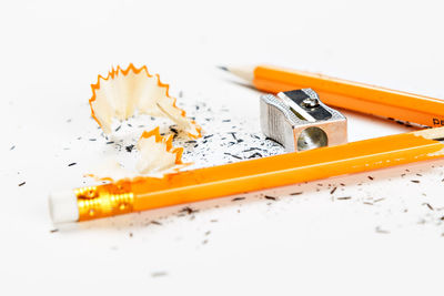 Close-up of yellow pencils on table