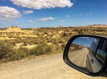 Reflection of road on side-view mirror