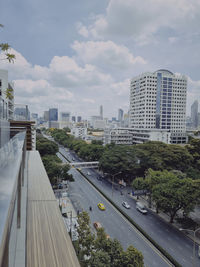 High angle view of road by buildings against sky