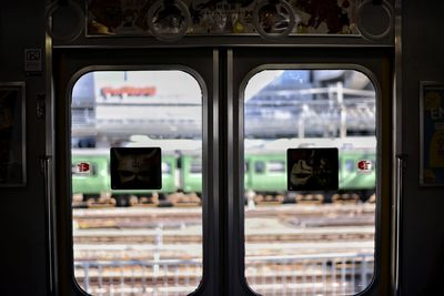 Close-up of train seen through window