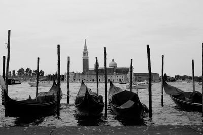Gondolas moored on grand canal against st marks square
