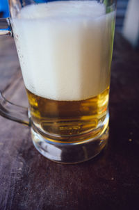 Close-up of beer in glass on table