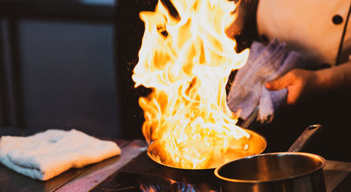 Cropped image of person preparing food