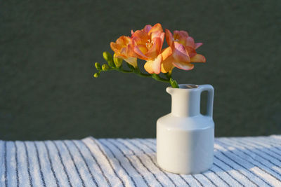 Close-up of rose flower vase on table