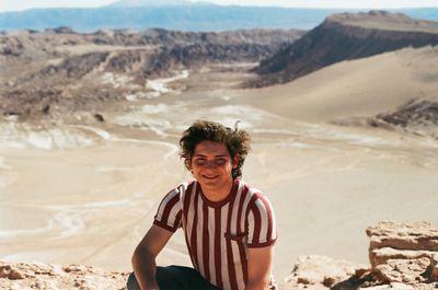 Portrait of man on arid landscape