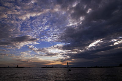 Scenic view of sea against dramatic sky