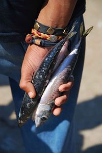 Hand with fishes