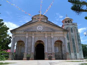 Low angle view of church against blue sky