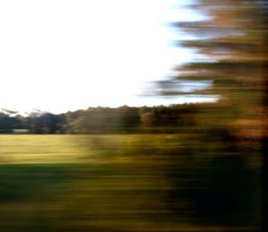 Defocused image of field against clear sky