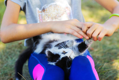 Midsection of woman with cat