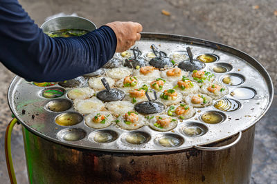 High angle view of man preparing food