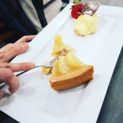 High angle view of person preparing food in plate