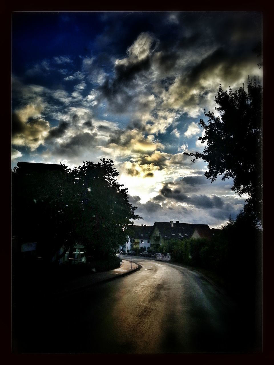 sky, tree, cloud - sky, transfer print, cloudy, road, transportation, sunset, silhouette, cloud, building exterior, auto post production filter, car, the way forward, built structure, street, architecture, dusk, overcast, land vehicle