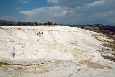 White calcium mountain with granite with small waterfall in summer in pamukkale turkey