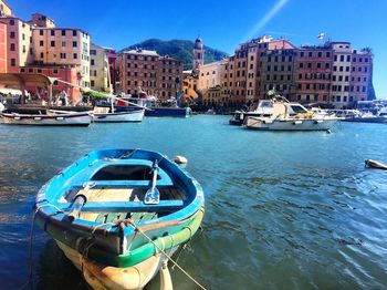 Boats moored at harbor