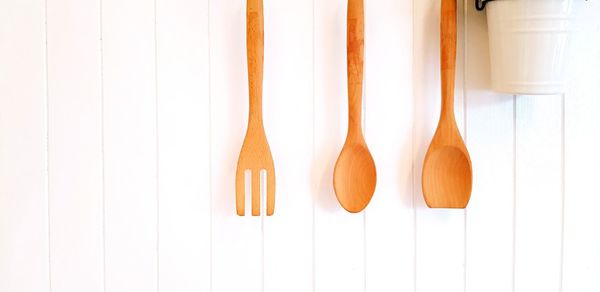 Close-up of wooden spoon and fork on table