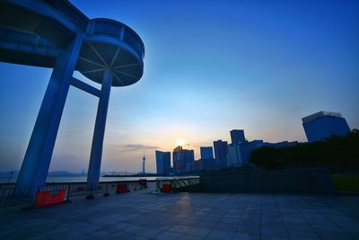 View of cityscape against clear sky at sunset