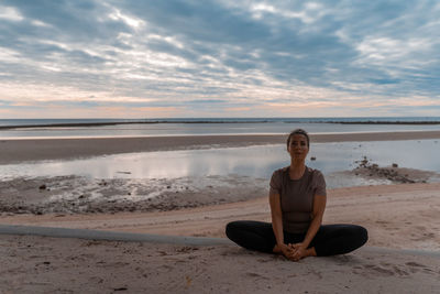 Yoga asanas on the background of dawn