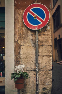 Warning sign on wall of building