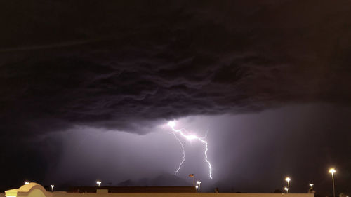 Low angle view of lightning in sky at night