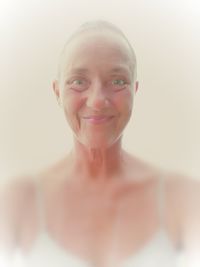 Portrait of a smiling young woman over white background