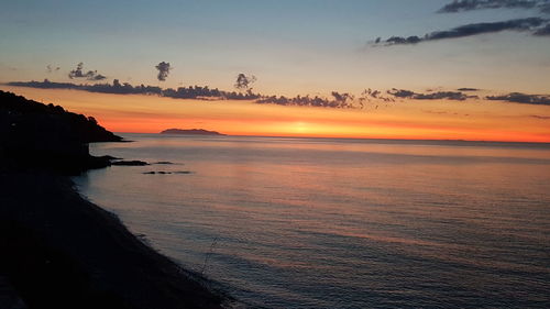 Scenic view of sea against sky during sunset