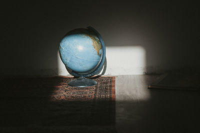 Globe on a carpet on the floor