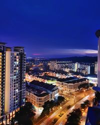 High angle view of illuminated cityscape at night