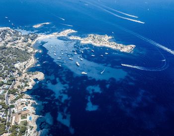 High angle view of sea against blue sky