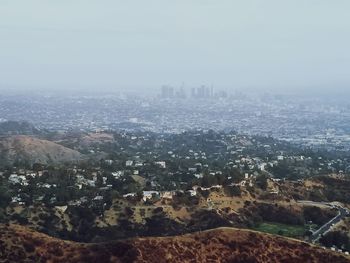 Aerial view of cityscape against sky