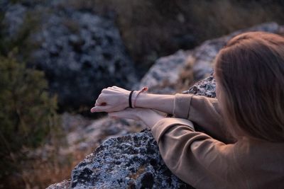 Portrait of woman on rock