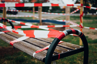 Close-up of empty seats on railing