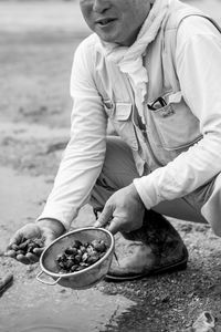 Midsection of man preparing food