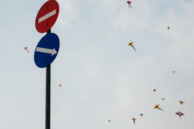 Low angle view of birds flying in sky